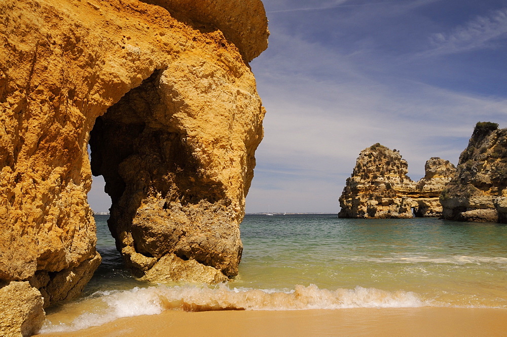 Rock archways at Praia do Camilo (Camel beach), Lagos, Algarve, Portugal, Europe