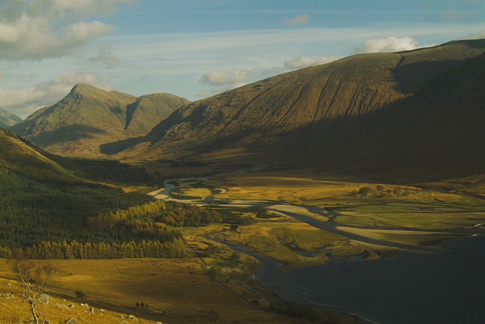 Glen Etive Valley and top of Loch Etive from high view point in Autumn featuring sun breaking through broken cloud.  , Scotland