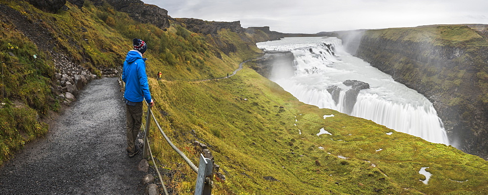 Tourist at Gullfoss Waterfall in the canyon of the Hvita River, The Golden Circle, Iceland, Polar Regions