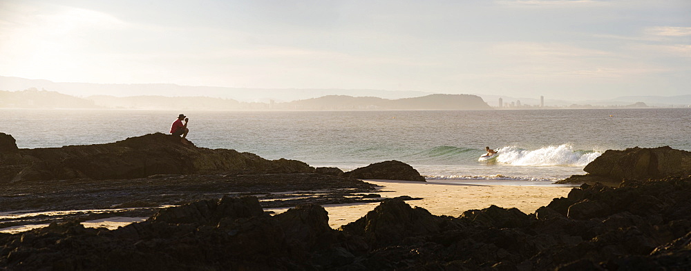 Australian man watching surfers at Tweed Heads, Gold Coast, Queensland, Australia, Pacific