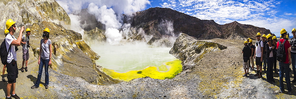 Tourists exploring White Island Volcano, an active volcano in the Bay of Plenty, North Island, New Zealand, Pacific