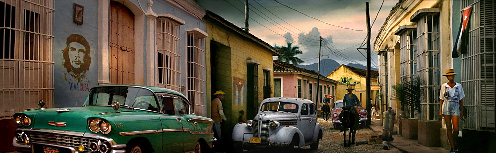 Street scene with oldtimer, horse and Che Guevara wall painting, Trinidad, Sancti Spiritus, Cuba, Carribean, North America, America