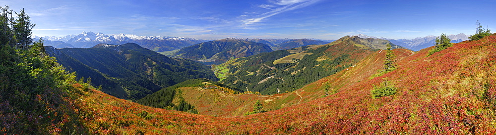 Panorama from Hundstein above village Zell am See with Wiesbachhorn, Hoher Tenn and Kitzsteinhorn in the Hohe Tauern range and Schmittenhoehe, Schwalbenwand and Birnhorn, Hundstein, Dientner Schieferberge range, Dientner Schieferalpen, Salzburg, Austria