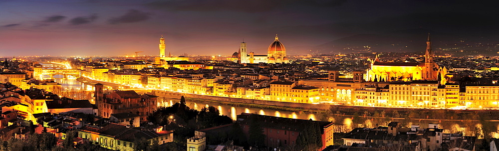 Panorama of illuminated Florence with the Ponte Vecchio bridge, Palazzo Vecchio, cathedral Santa Maria del Fiore and San Croce, Florence, UNESCO world heritage site, Tuscany, Italy