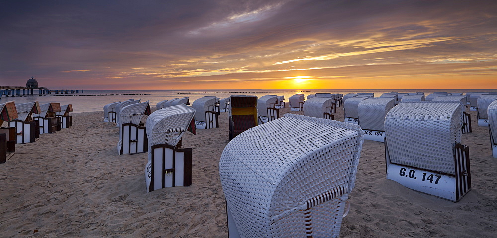 Hooded beach chairs near Sellin pier in the morning light, Ruegen, Mecklenburg-Western Pomerania, Germany