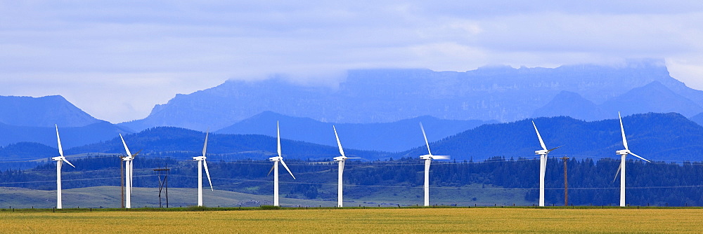 Wind turbines with Rocky Mountains in background, Pincher Creek, Alberta