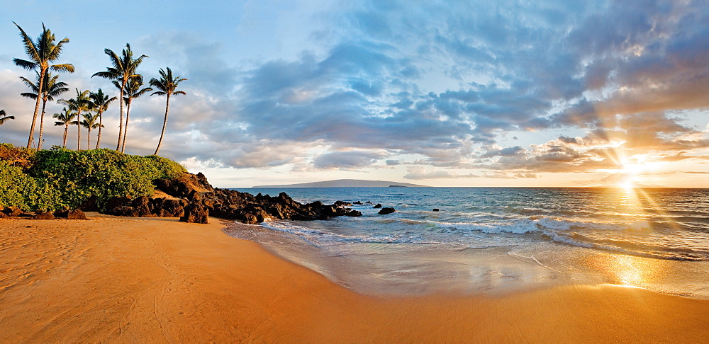 Hawaii, Maui, Makena, Secret Beach at sunset.