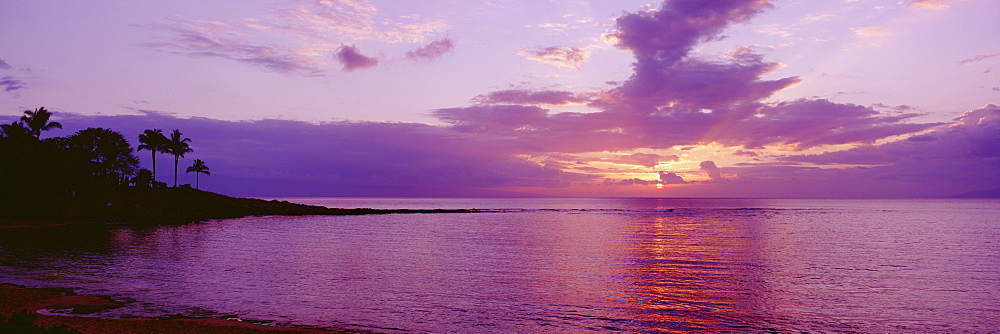 Hawaii, Maui, Kapalua Beach, Purple sunset over ocean.