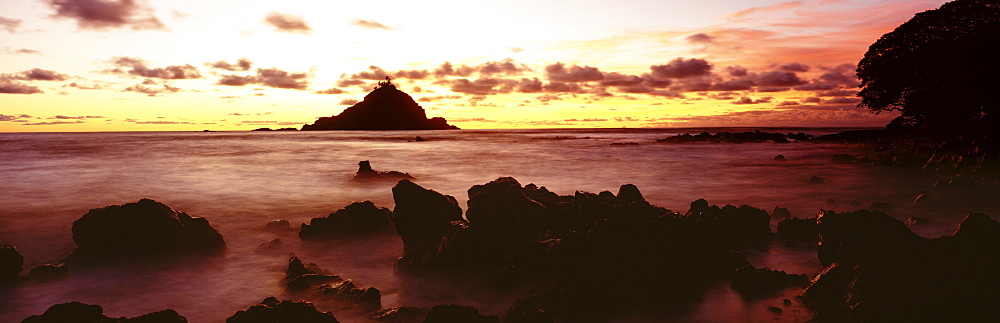 Hawaii, Maui, Hana, View of Alau Island from Hana shore at sunrise.