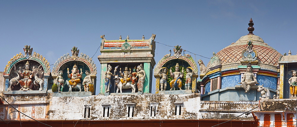 Hindu religious icons above Hindu Temple at Kedar Ghat during Festival of Shivaratri in holy city of Varanasi, Northern India