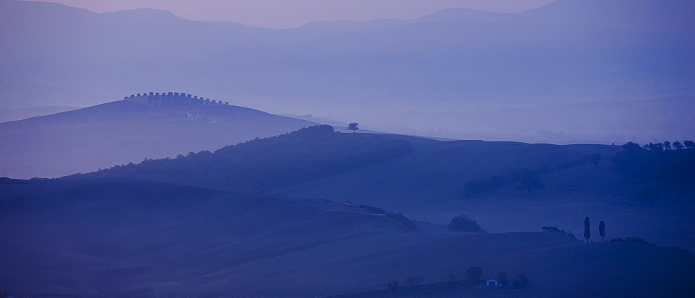 Tuscan landscape of hill slopes in Val D'Orcia, Tuscany, Italy