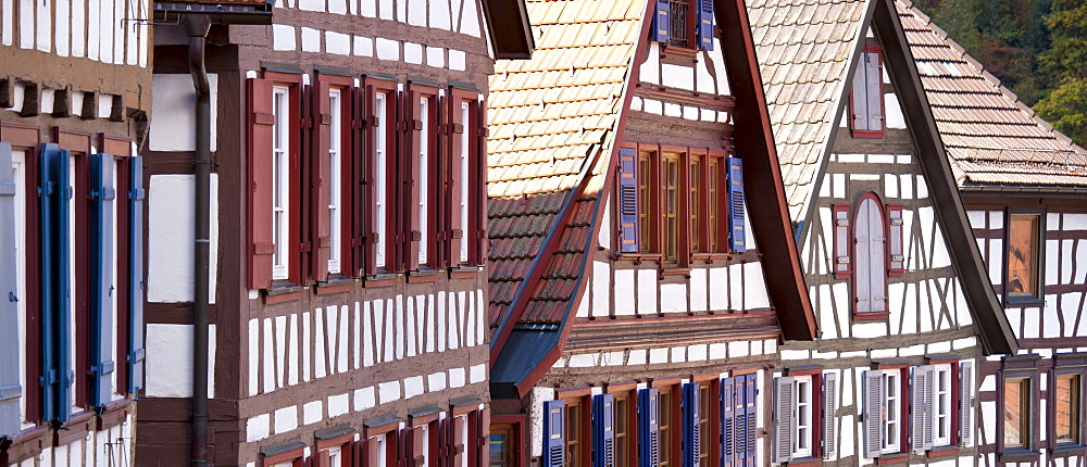 Windows and wooden shutters of quaint timber-framed houses in Schiltach in the Bavarian Alps, Germany