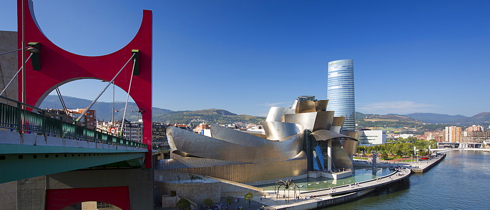 Frank Gehry's Guggenheim Museum, Red Bridge - Principes de Espana Bridge, Iberdrola Tower and River Nervion at Bilbao, Spain