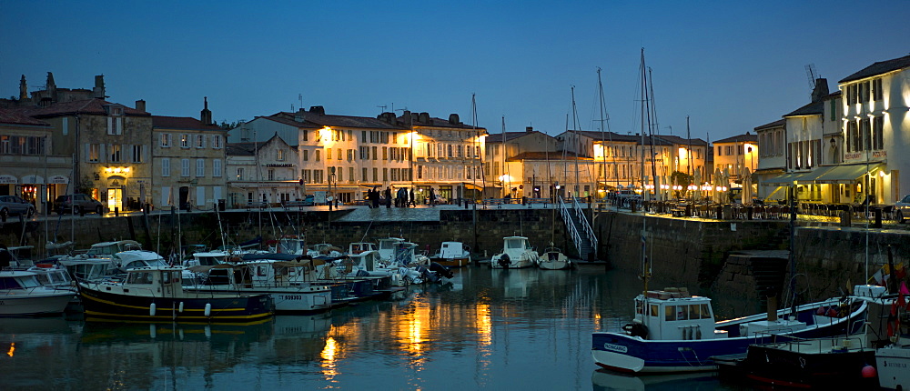 Harbour scene at dusk of Quai Job Foran, St Martin de Re on Ile de Re in France