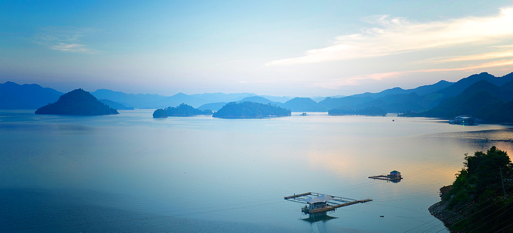 A calm view of southeast Qiandao Lake in Zhejiang province at dusk, Zhejiang, China, Asia