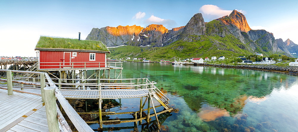 Panoramic of the fishing village surrounded by sea and midnight sun, Reine, Nordland county, Lofoten Islands, Arctic, Northern Norway, Scandinavia, Europe