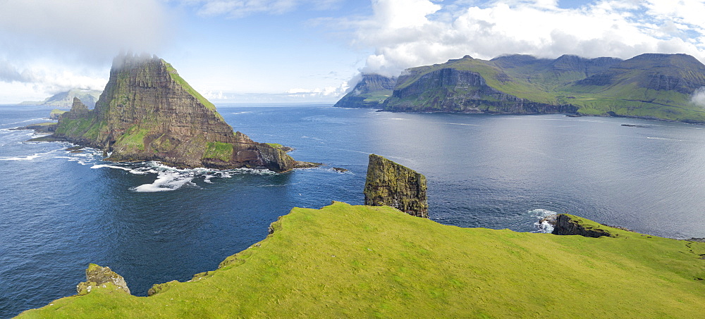 Panoramic of Drangarnir and Tindholmur islet, Vagar Island, Faroe Islands, Denmark, Europe (Drone)