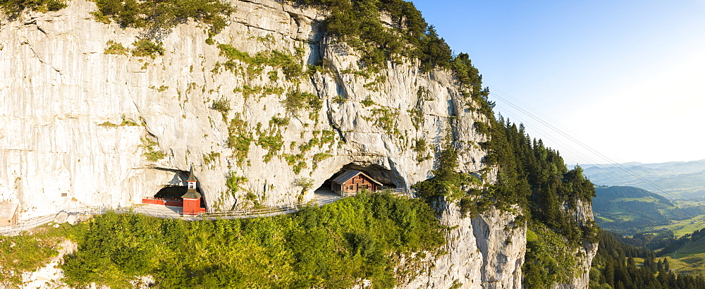 Aerial panoramic of Wildkirchli (Wild Chapel) and caves, Ebenalp, Appenzell Innerrhoden, Switzerland, Europe