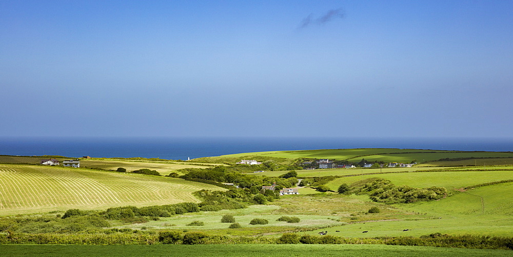 The small hamlet of Porthgain nestled among the cliffs along the Pembrokeshire coast path on a summers day, Wales, United Kingdom, Europe