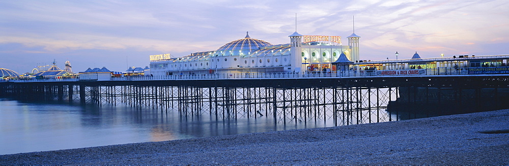 The beach and Palace Pier, Brighton, East Sussex, England, UK, Europe