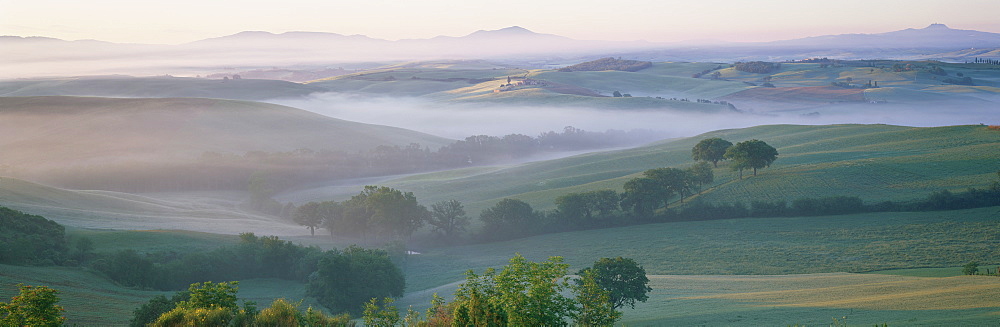 Misty dawn view across Val d'Orcia towards the Belvedere, near San Quirico d'Orcia, Tuscany, Italy, Europe