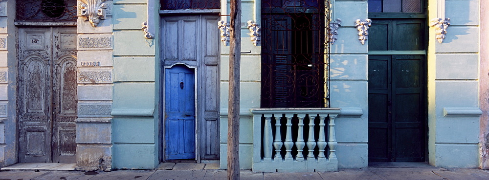 Facade of old colonial house in evening light, Cienfuegos, Cuba, West Indies, Central America