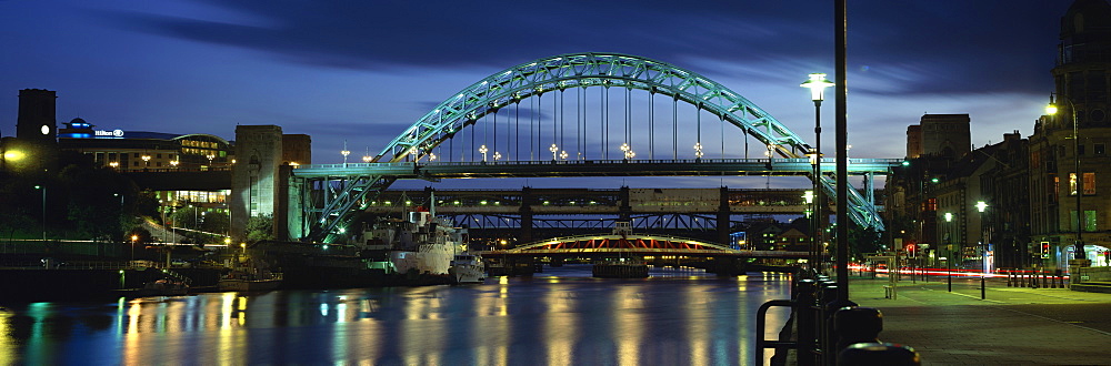 Dusk view towards Tyne Bridge over River Tyne, Quayside, Newcastle upon Tyne, Tyne and Wear, England, United Kingdom, Europe