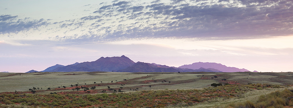 Panoramic view at dusk over the magnificent landscape of the Namib Rand game reserve, Namib Naukluft Park, Namibia, Africa