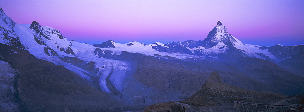 Panoramic view of pink sky before sunrise over the Lower Theodul Glacier and the Matterhorn mountain, Zermatt, Valais (Wallis), Swiss Alps, Switzerland, Europe