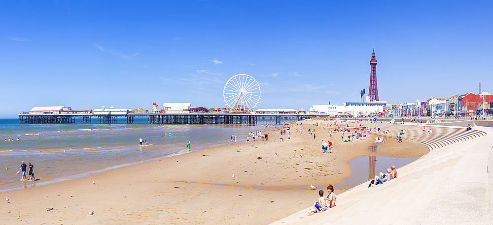 Blackpool Tower, Blackpool Beach, Blackpool Central Pier with holidaymakers and tourists, Blackpool, Lancashire, England, United Kingdom, Europe