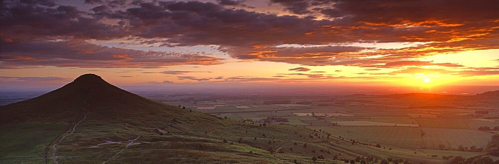 Silhouette of a hill at sunset, Roseberry Topping, North Yorkshire, Cleveland, England