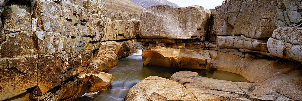 River flowing through a rocky landscape, Glen Etive River, Scotland