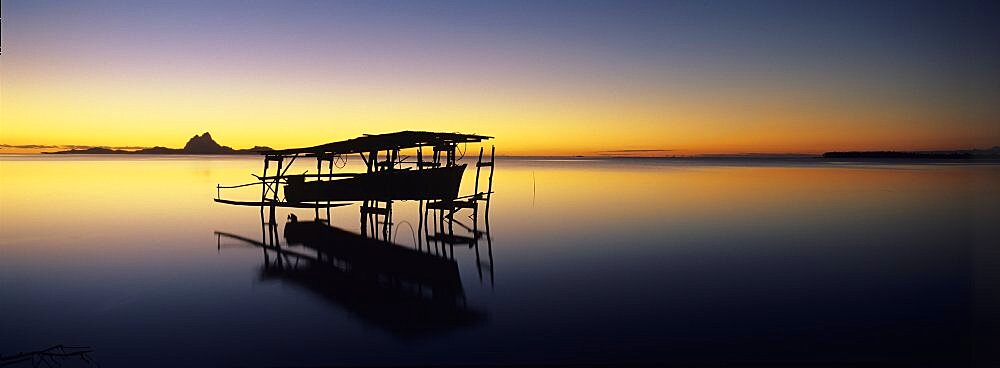 Silhouette of a beach hut in the sea, Bora Bora, French Polynesia