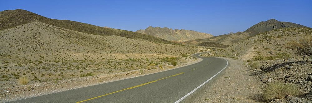 Empty road passing through a landscape, Nevada, USA