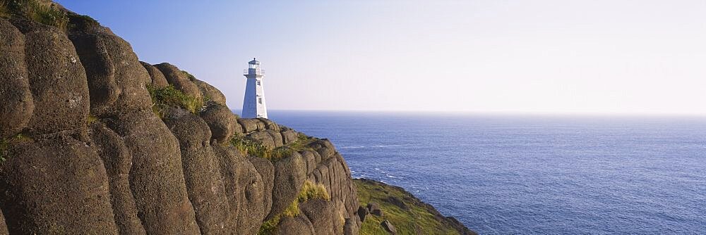 Lighthouse on a rocky coast, Cape Spear, Newfoundland, Canada