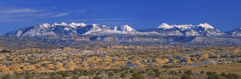 Sand dunes on a landscape, La Sal Mountains, Red Rock Hills, Arches National Park, Utah, USA