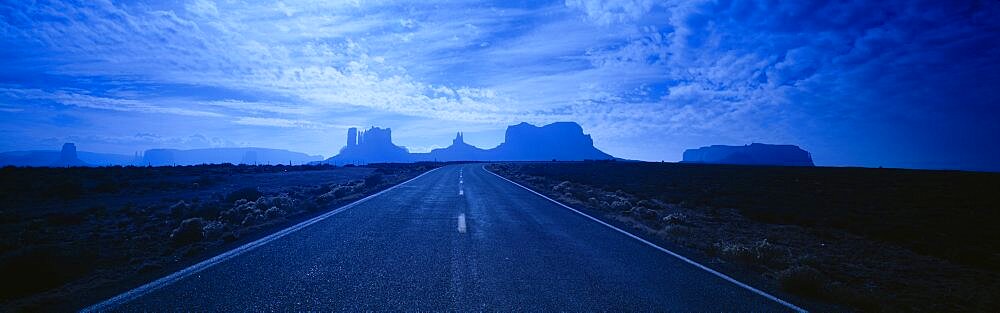 Empty Road Leading Towards Rock Formations, Monument Valley Tribal Park, Arizona, USA