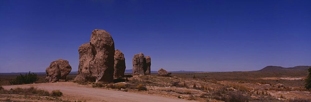 Rock formations on an arid landscape, New Mexico, USA
