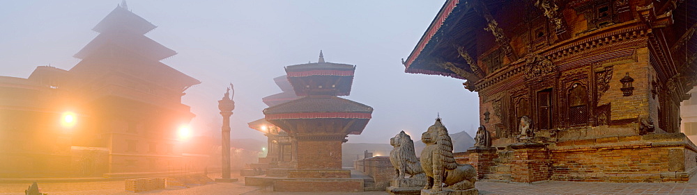 Misty winter dawn and temples in Durbar Square, including Degu Talle, Yoganarendra Malla on stone pillar, Jagan Naryan Mandir, UNESCO World Heritage Site, Patan, Kathmandu Valley, Nepal, Asia