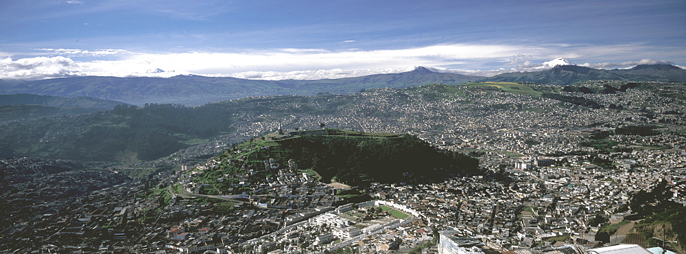 Ecuador's capital and second largest city a view of Quito with Cotopaxi, at 5900 meters, 19,350ft, the world's highest active volcano, Quito, Ecuador