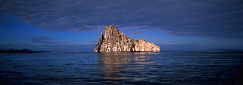 Two spectacular volcanic plugs form Kicker rock, a favorite scuba diving site located off San Cristobal Island, Galapagos Islands, Ecuador