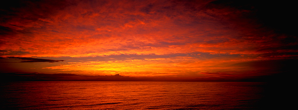 Sunset to the west of Wolf Island one of the newest and most northerly of the Galapagos Islands, Ecuador