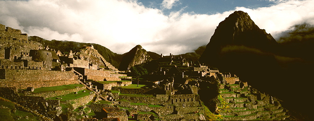 Machu Picchu view of the ancient city with Huayna Picchu Peak above the Rio Urubamba in the Vilcabamba Mountains north of Cuzco, Highlands, Peru