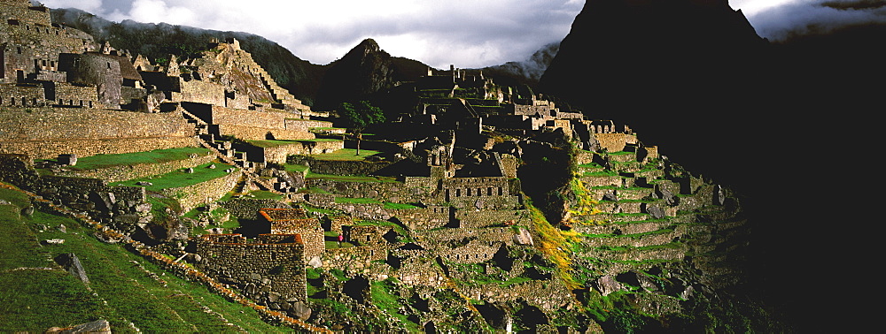 Machu Picchu view of the ancient city with Huayna Picchu Peak above the Rio Urubamba in the Vilcabamba Mountains north of Cuzco, Highlands, Peru