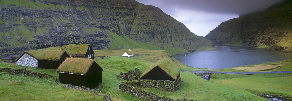 Traditional turf roofed farm buildings and church, Saksun, Streymoy Island, Faroe Islands (Faroes), Denmark, Europe