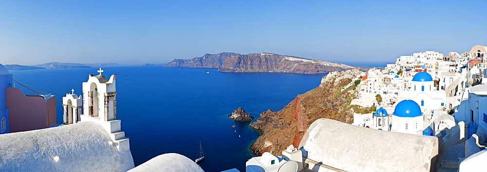 Blue domed churches in the village of Oia, Santorini (Thira), Cyclades Islands, Aegean Sea, Greek Islands, Greece, Europe