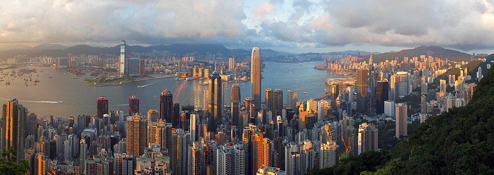 Panoramic view with the illuminated skyline of Central below The Peak, seen from Victoria Peak, Hong Kong, China, Asia