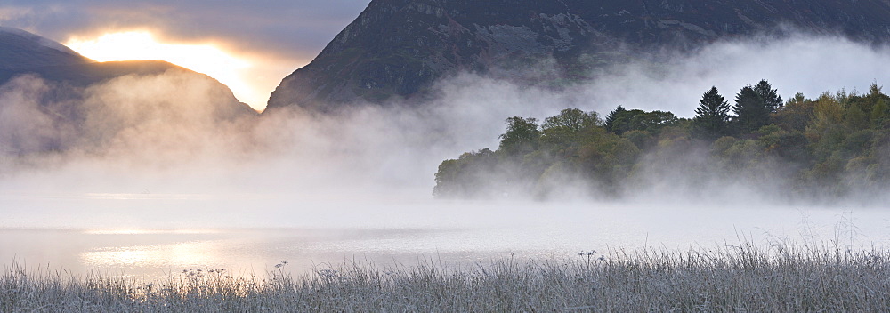 Mist shrouds Loweswater at sunrise, Lake District, Cumbria, England, United Kingdom, Europe