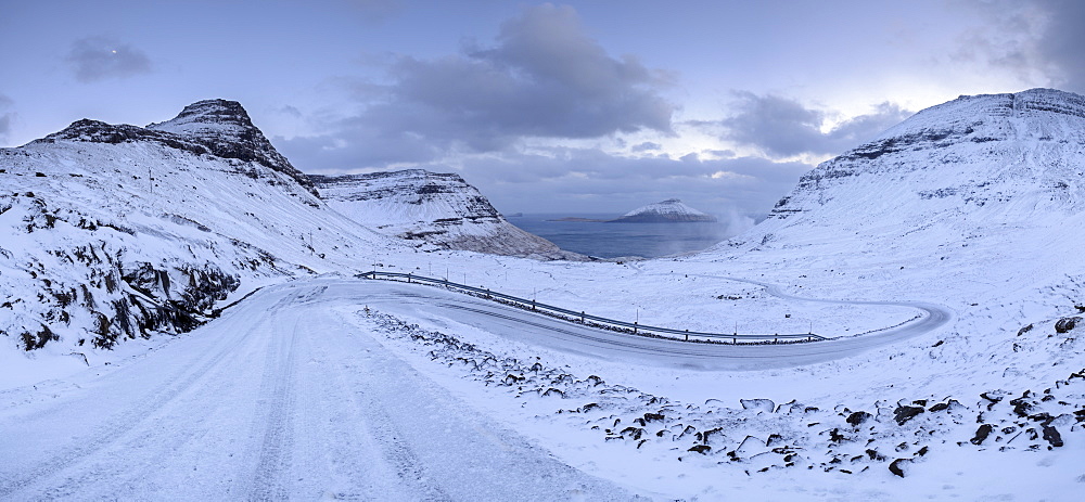 Snow covered mountain road in winter on the Island of Streymoy, Faroe Islands, Denmark, Europe