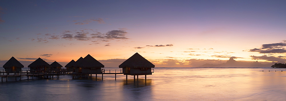 Overwater bungalows at Le Meridien Tahiti Hotel at sunset, Papeete, Tahiti, French Polynesia, South Pacific, Pacific